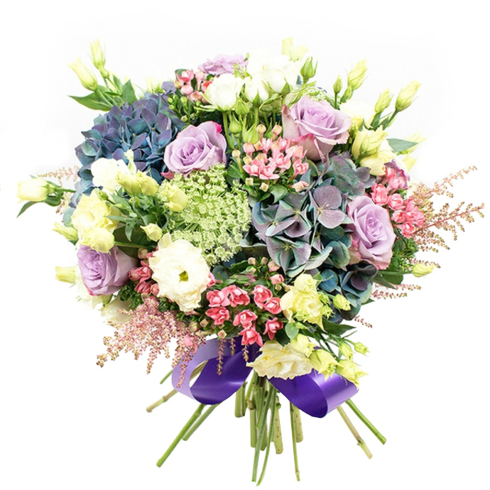 This elegant floral arrangement, handcrafted by the Forest Hill team, showcases an exquisite selection of blooms in a harmonious spectrum, reminiscent of the area's tranquil parks. Tall, impressive hydrangea heads burst forth in deep indigo, teal, and smoky violet, forming the dramatic centrepiece of the bouquet. Around them swirl velvety lavender roses and delicate white and cream blooms, their petals extravagantly layered and emanating softness-just like the rose borders of Mayow Park. White ranunculus, with their finely ruffled forms, add plushness and subtle contrasts among the central flowers. Rising throughout are slender stems tipped with pale yellow-green lisianthus, some still unfurling, providing a cheery, airy effect. Vivid fuchsia-pink filler flowers are scattered between the dominant flowers, offering bursts of colour and dynamic movement, while feathery pale pink astilbe plumes trail along the fringe, creating a sense of playful motion. Delicately laced within are light green and white filler flowers, evocative of wild meadows on the edge of Forest Hill. A touch of glossy dark green foliage subtly frames the blend, enhancing the composition's natural look. Tied at the base, a wide, resplendent royal purple satin ribbon adds a luxurious and sophisticated finish, reflecting the creative spirit of SE23. Perfect as a celebratory gift or centerpiece for any Forest Hill event, this bouquet embodies the perfected artistry of local florists and the unique beauty of the neighbourhood.